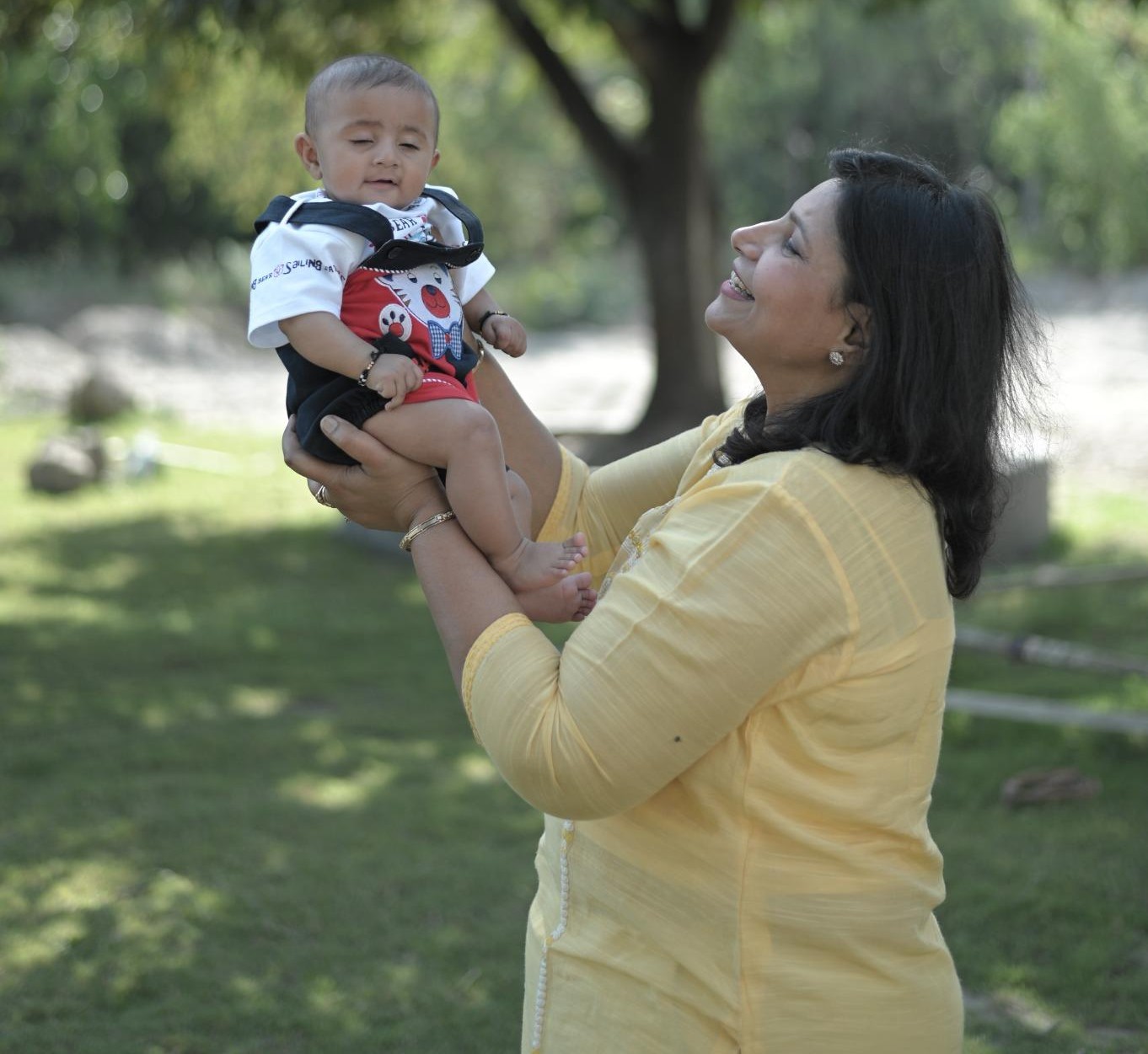 Dr. Monika Singh holding a baby